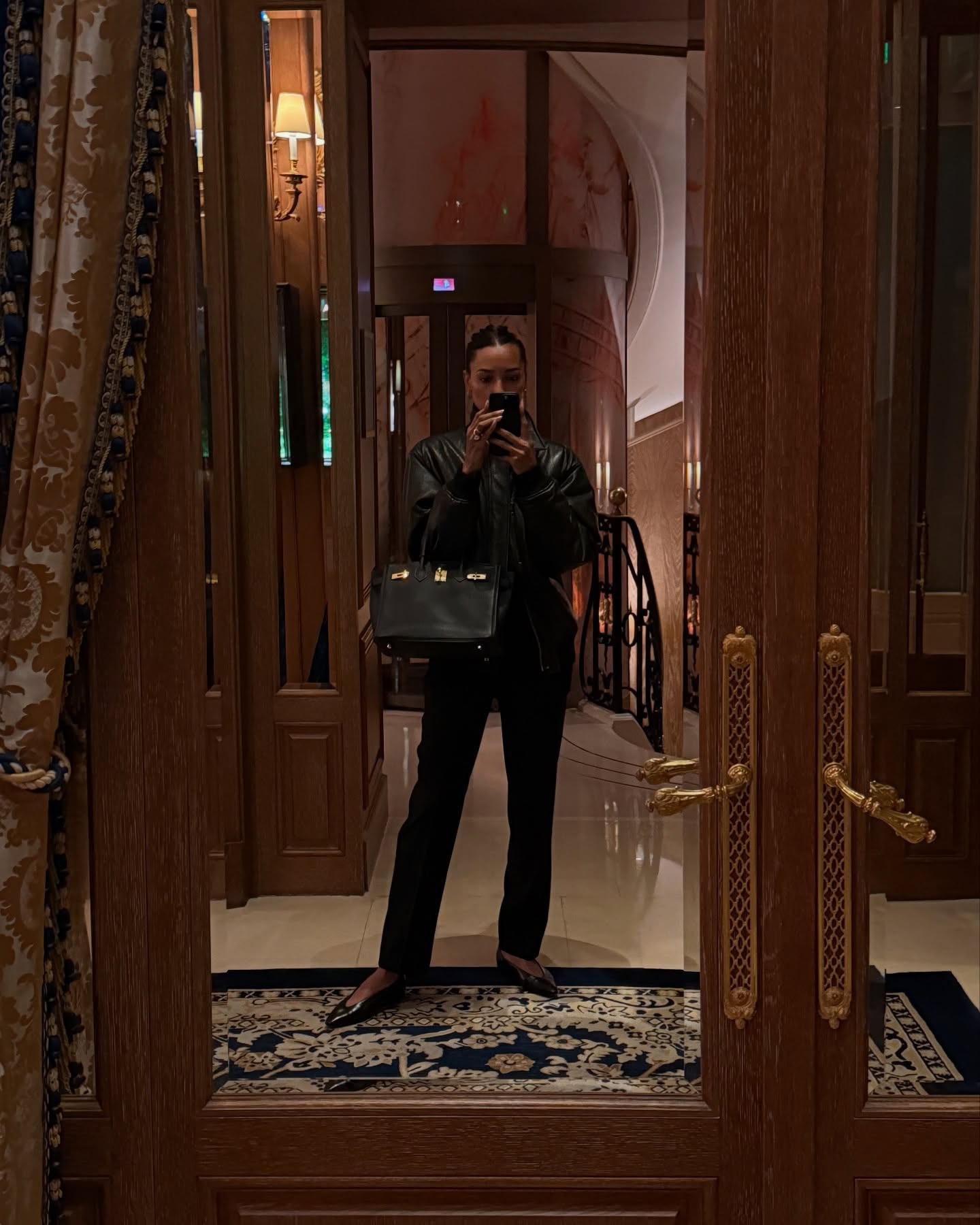 Woman wears black jeans and almond toe flats.