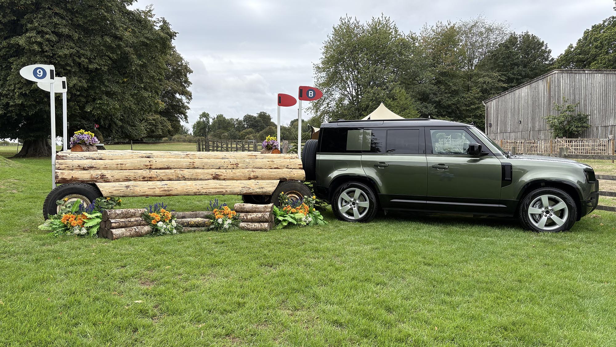 Wooden trailer fence, towed by a Defender, on the Burghley cross-country course 2026