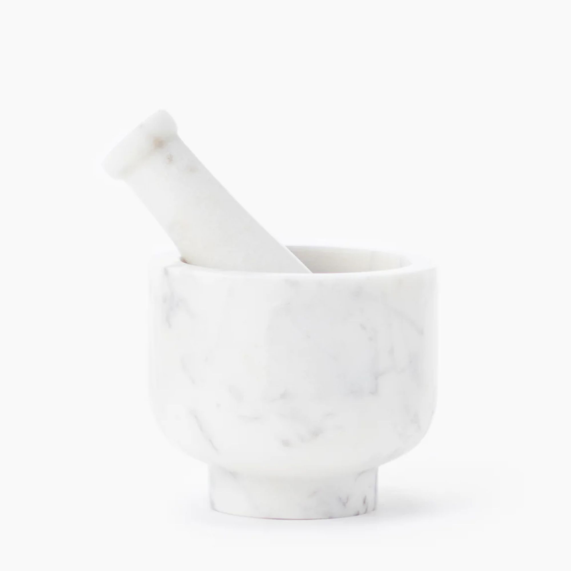 white marble mortar and pestle