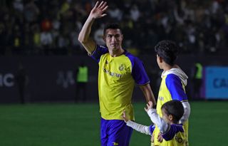 Cristiano Ronaldo, with his children, waves to fans of Al-Nassr at his official presentation with the Saudi Pro League club in January 2023.