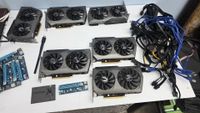 A dismantled mining rig with six Zotac RTX 3070 GPUs