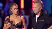 Teddi Mellencamp presents the iHeartRadio Icon Award to honoree John Mellencamp onstage during the 2026 iHeartRadio Music Award