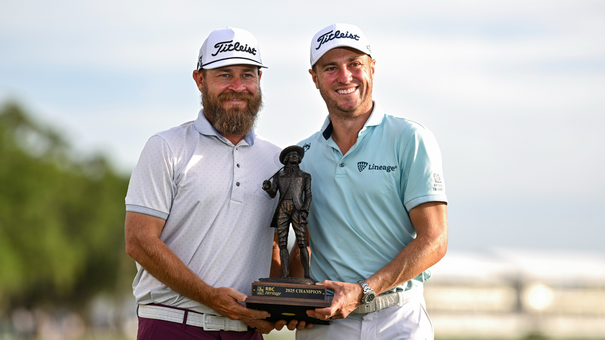 Joe Greiner and Justin Thomas pose for a photograph with the RBC Heritage trophy