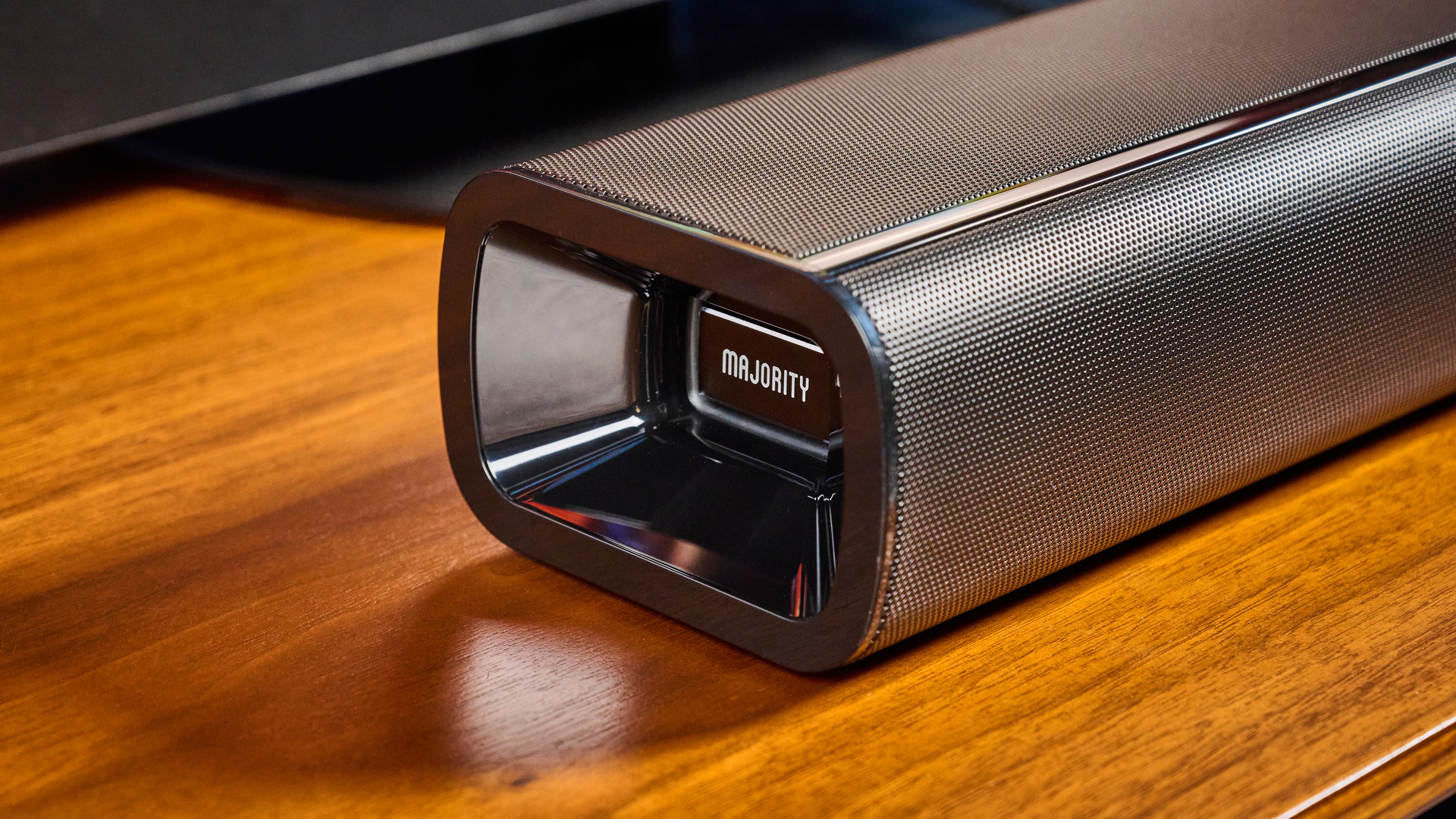 the budget majority naga 60 soundbar in black, showing its buttons and remote