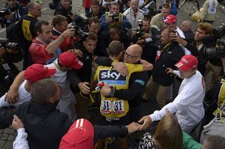 Chris Froome and Sky manager David Brailsford celebrate in Paris