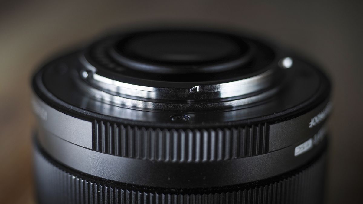 OM System M.Zuiko 17mm f/1.8 II lens on a wooden surface