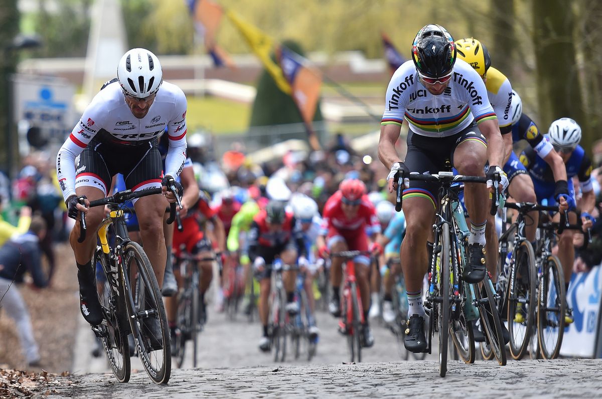Fabian Cancellara, left, and Peter Sagan, right, riding the Kemmelberg