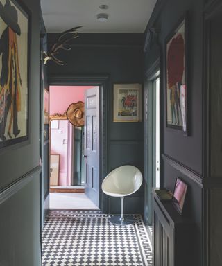entry way painted in Farrow & Ball's Down Pipe, patterned tiles, artwork, pink room to rear