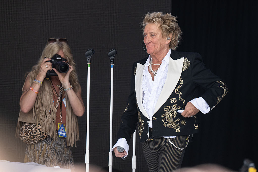 Penny Lancaster photographs Rod Stewart as he performs on The Pyramid Stage during day five of Glastonbury festival 2025 at Worthy Farm, Pilton on June 29, 2025 in Glastonbury, England.
