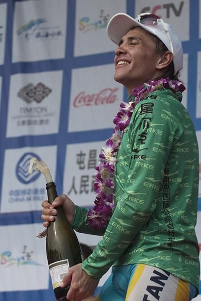 A delighted Valentin Iglinskiy (Astana) on the podium in the green jersey as winner of the sprint points competition.