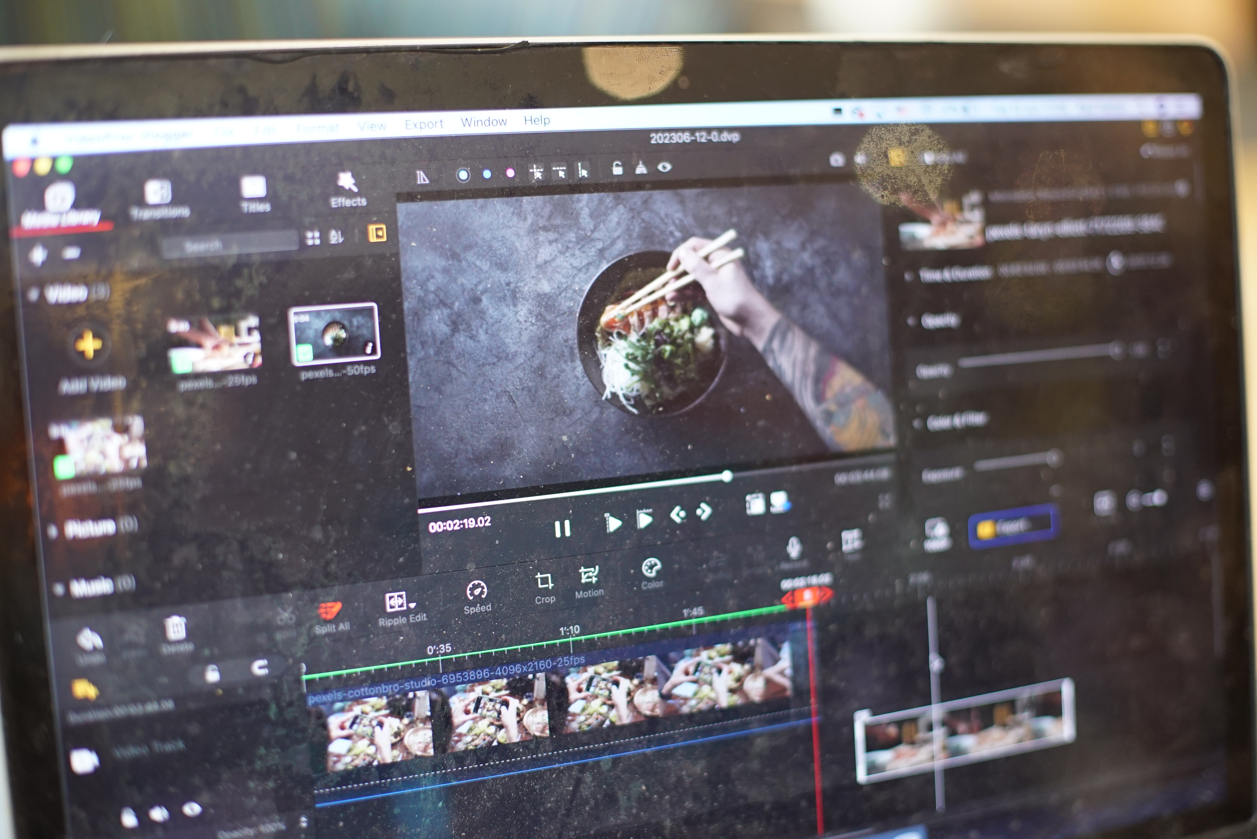 A laptop using VideoProc Vlogger video-editing software