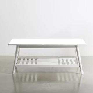 A white coffee table with under storage