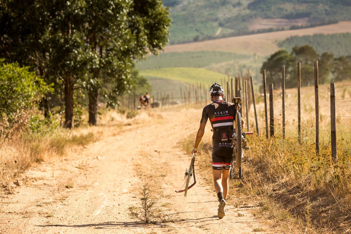 A rider walks on stage 5 of the Cape Epic