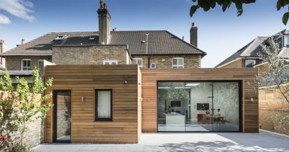 home insurance: Clad extension with sliding doors and a separate door to outside