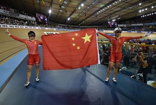 Tianshi Zhong and Lin Junhong (China) celebrate gold and silver in the sprint