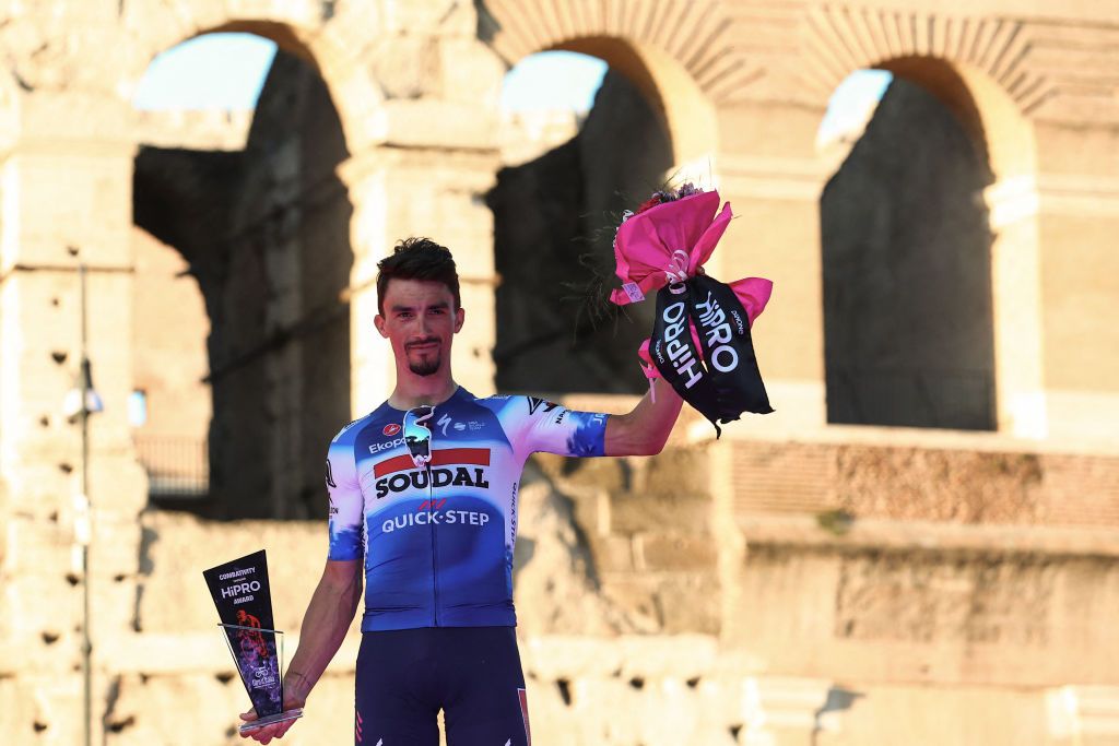 Team Soudal-Quick Step&#039;s French rider Julian Alaphilippe celebrates the overall most combative rider award on the podium in front of the Colosseum, after the 21st and last stage of the 107th Giro d&#039;Italia cycling race, 125km from Rome to Rome on May 26, 2024. (Photo by Luca Bettini / AFP)