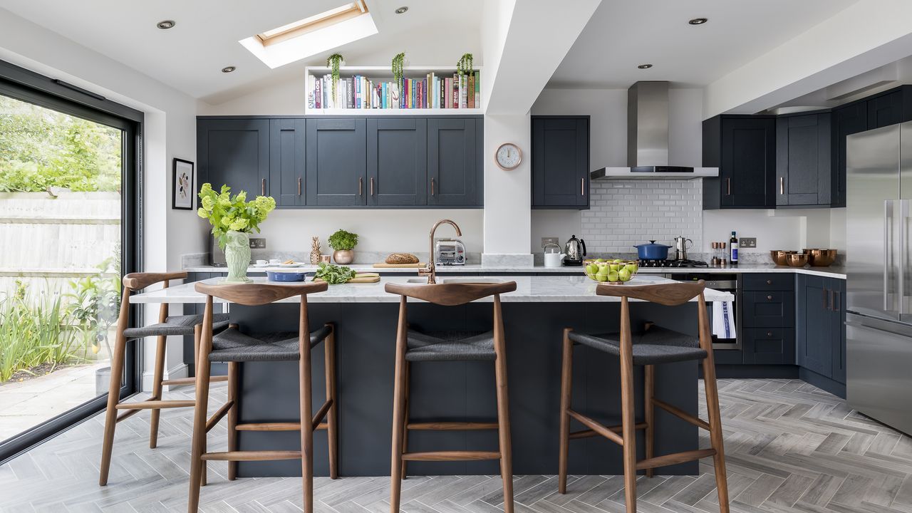 Black Shaker kitchen with island and brown bar stools