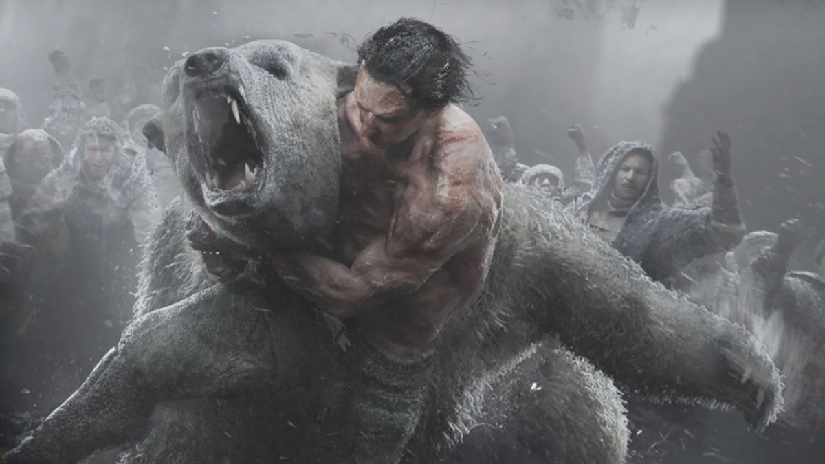 A man wrestling a polar bear while people watch