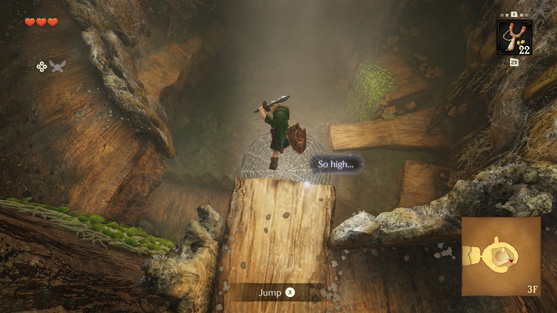 Inside The Great Deku Tree, Link jumps off a wooden ledge in The Legend of Zelda: Ocarina of Time remake