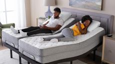 A couple sleeps on their split king mattress with adjustable base 