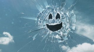 A broken glass smiley face from Black Mirror.