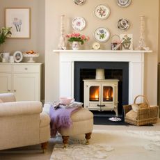 White wall with fireplace and armchair