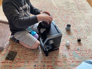 Max playing with the Casdon Delonghi Coffee Machine