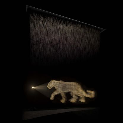 Cartier scented installation OSNI 2 with panther made out of perfume and light 