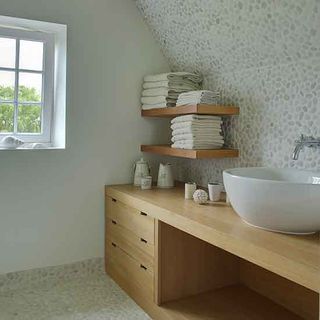 children bathroom with pebble mosaic tiles and wash basin