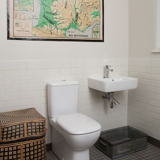 bathroom with map and commode