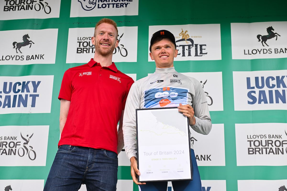 Picture by Will Palmer/SWpix.com - 04/09/2024 - Lloyds Bank Tour of Britain 2024 - Stage 2:&Acirc;&nbsp;Darlington to Redcar, England - Oscar Onley (Team dsm-firmenich PostNL) on the podium leading the Best Young Rider classification which is presented by Ed Clancy OBE