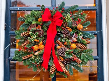A traditional Christmas wreath on a front door