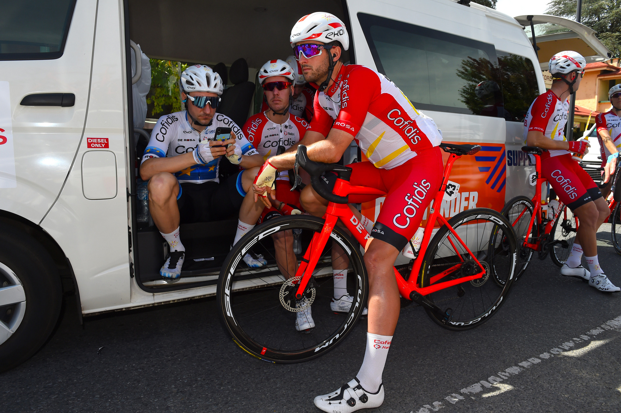 Nathan Haas chats with Cofidis teammate and European road race champion Elia Viviani ahead of the start of stage 2 of the 2020 Tour Down Under in Woodside