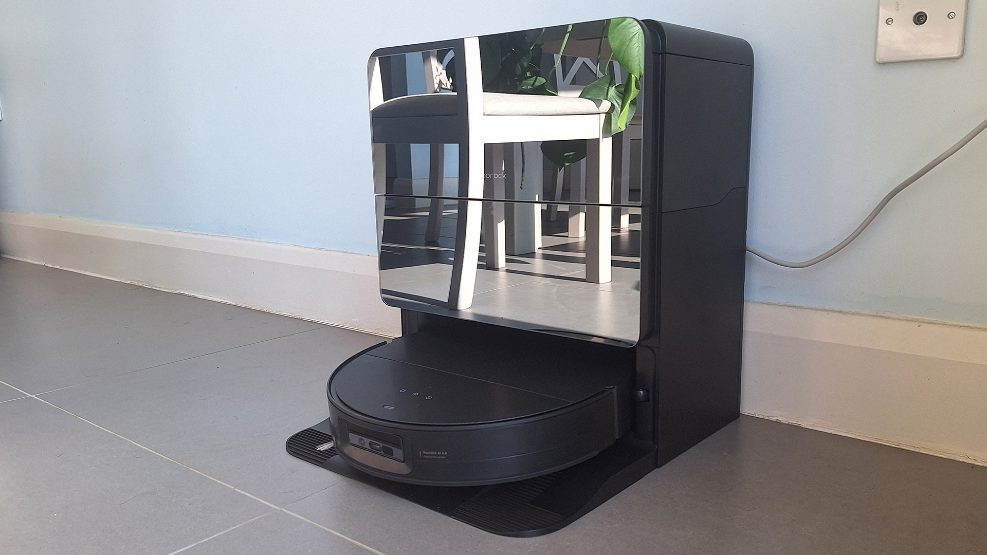 Roborock Saros 10 robot vacuum in its dock, in reviewer's home