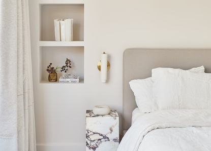 An all-white minimalist bedroom