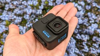 GoPro Hero 11 Black Mini in the palm of our expert reviewer's hand
