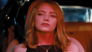 Emma Stone as Mia in the car with her husband stuck in traffic in La La Land.