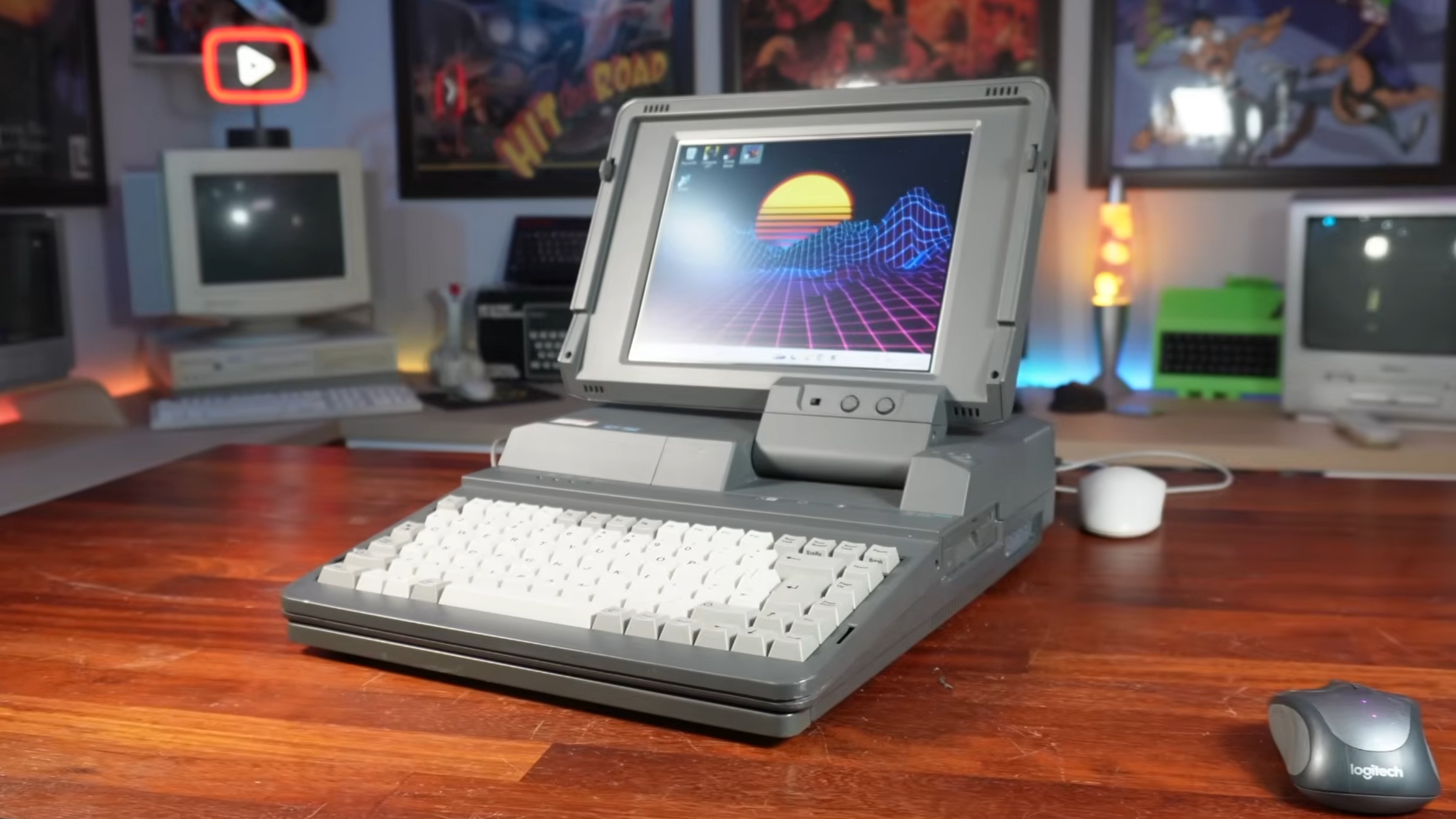 An Amstrad-ALT286 retro PC with a Minisforum UM890 Pro mini PC inside, on a desk with a retro mouse