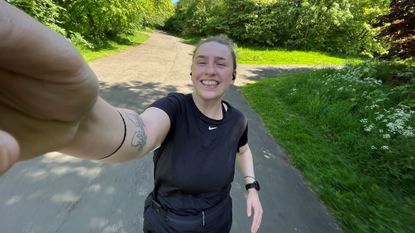 Woman running outside in the sunshine