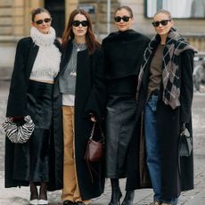 Copenhagn fashion week street style foud women in black and neutral outfits 
