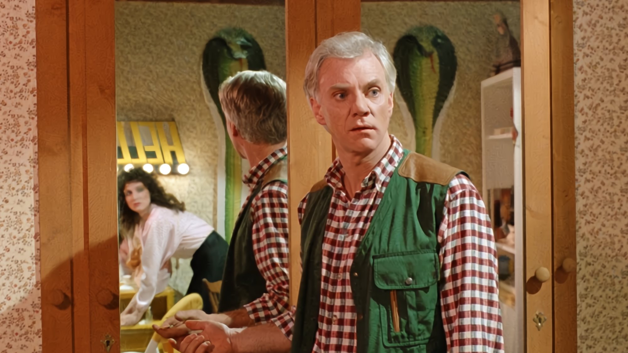 Madolyn Smith Osborne and Malcolm McDowell in The Caller (1987)