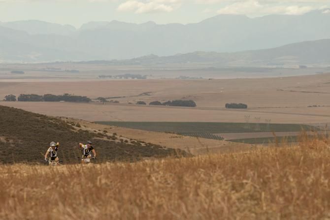 Riders reach the top of a climb during the Prologue
