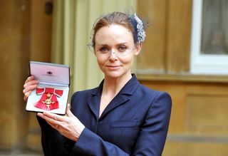 Stella McCartney collects her OBE from the Queen