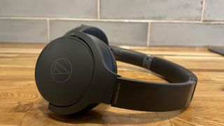 Audio-Technica ATH-S220BT on wooden surface
