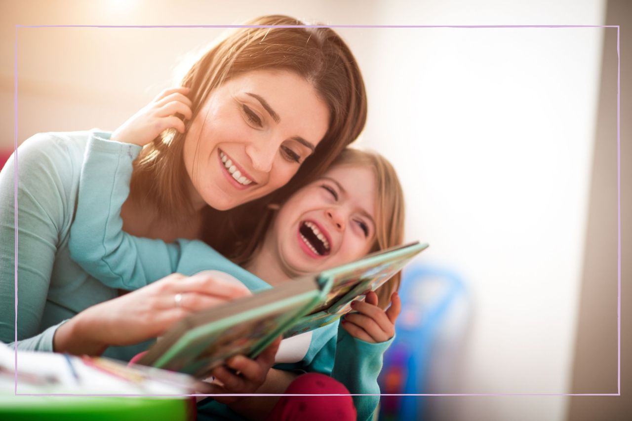 Mother reading with her happy daughter