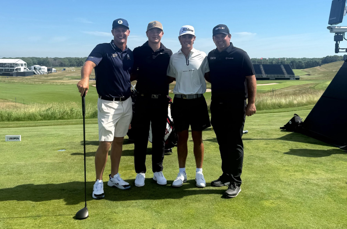 Bryson DeChambeau posing for a photo with his playing partners, including Patrick Reed, ahead of the 2026 US Open