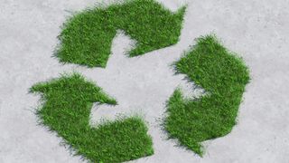 Recycling symbol made of grass