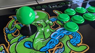 A close up of the stick and buttons on the Octopus Arcade Stick in use