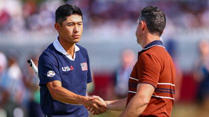 Collin Morikawa shakes hands with Rory McIlroy during the 2025 Ryder Cup at Bethpage Black