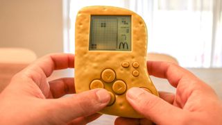 Playing the Chicken McNugget Tetris handheld gaming console